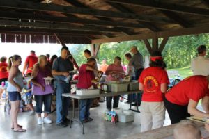 Oronoco Gold Rush Volunteers help cook and serve the food.